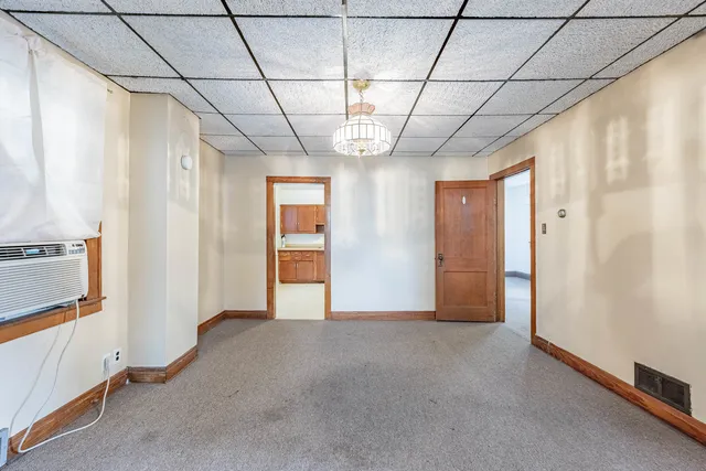 a view of empty room with windows