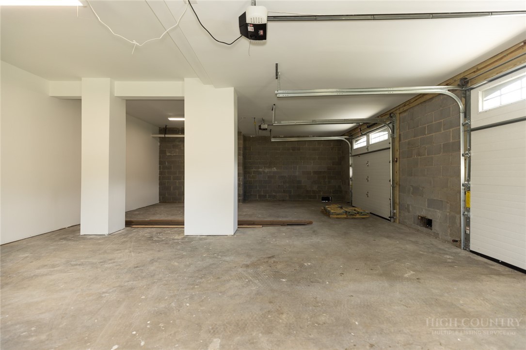 790 Howard Edmisten Road Sugar Grove, NC 28679 - Photo 29 of 45 an empty room with windows