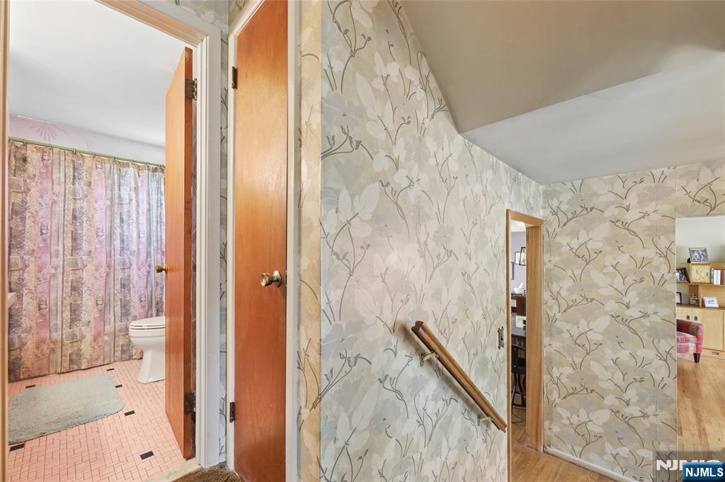 35 Robin Road Wayne, NJ 07470 - Photo 17 of 37 a bathroom with a shower and a glass door