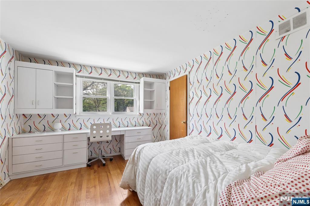 35 Robin Road Wayne, NJ 07470 - Photo 19 of 37 a bedroom with a bed and a couch