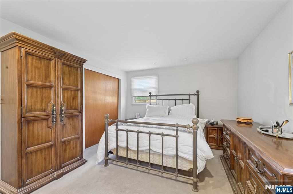 35 Robin Road Wayne, NJ 07470 - Photo 21 of 37 a bedroom with a bed and a dresser