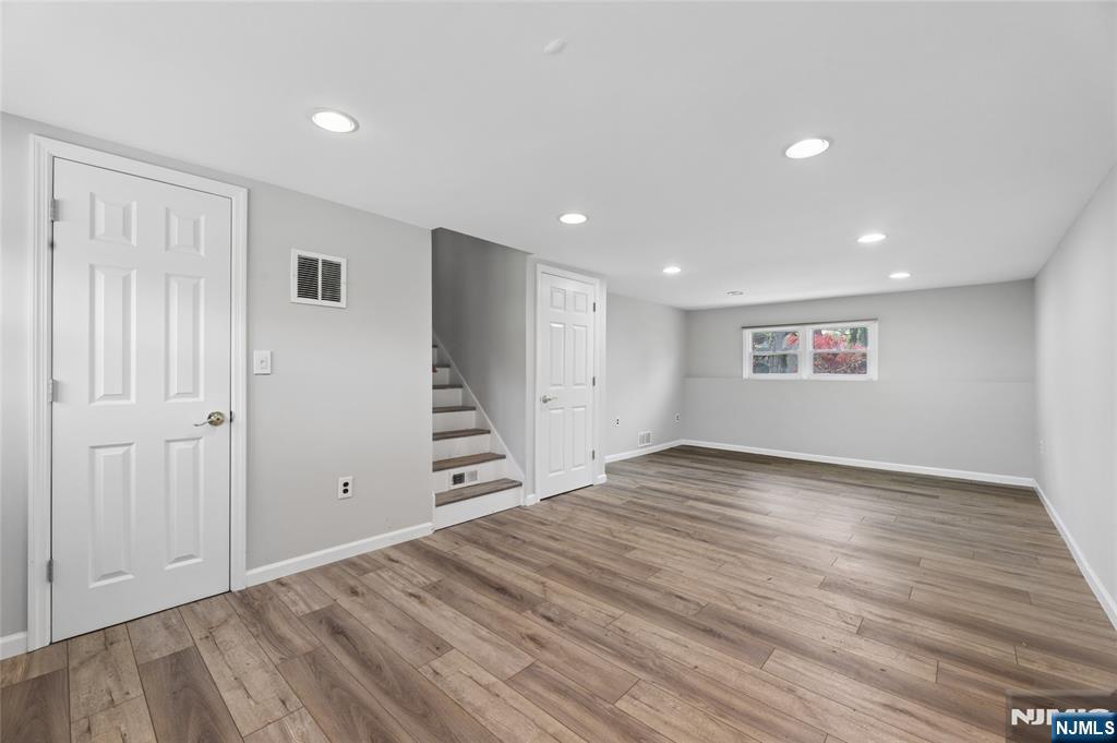 35 Robin Road Wayne, NJ 07470 - Photo 26 of 37 a view of empty room with wooden floor