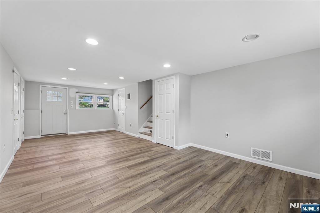 35 Robin Road Wayne, NJ 07470 - Photo 27 of 37 a view of empty room with wooden floor