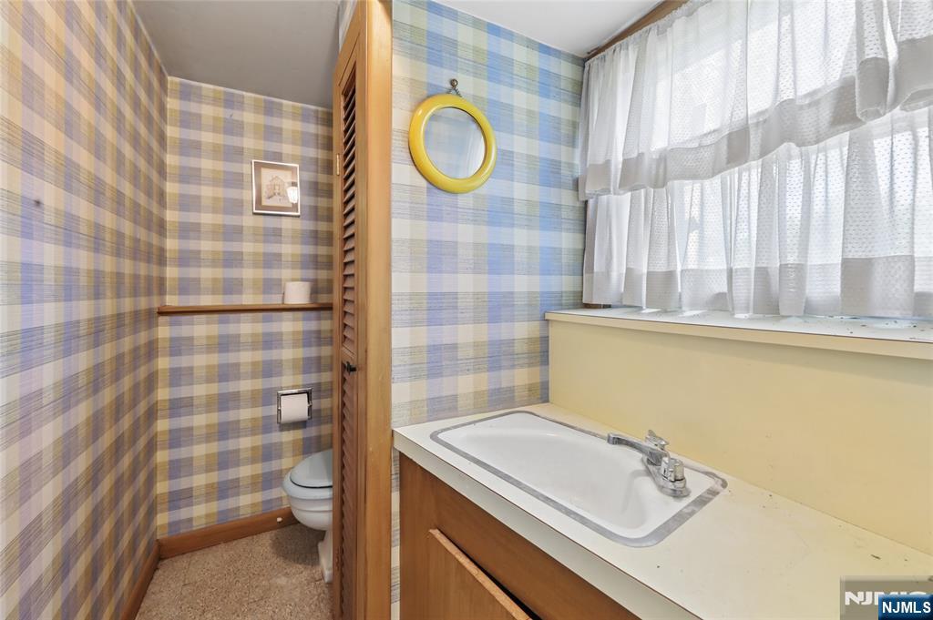 35 Robin Road Wayne, NJ 07470 - Photo 28 of 37 a bathroom with a sink toilet and shower