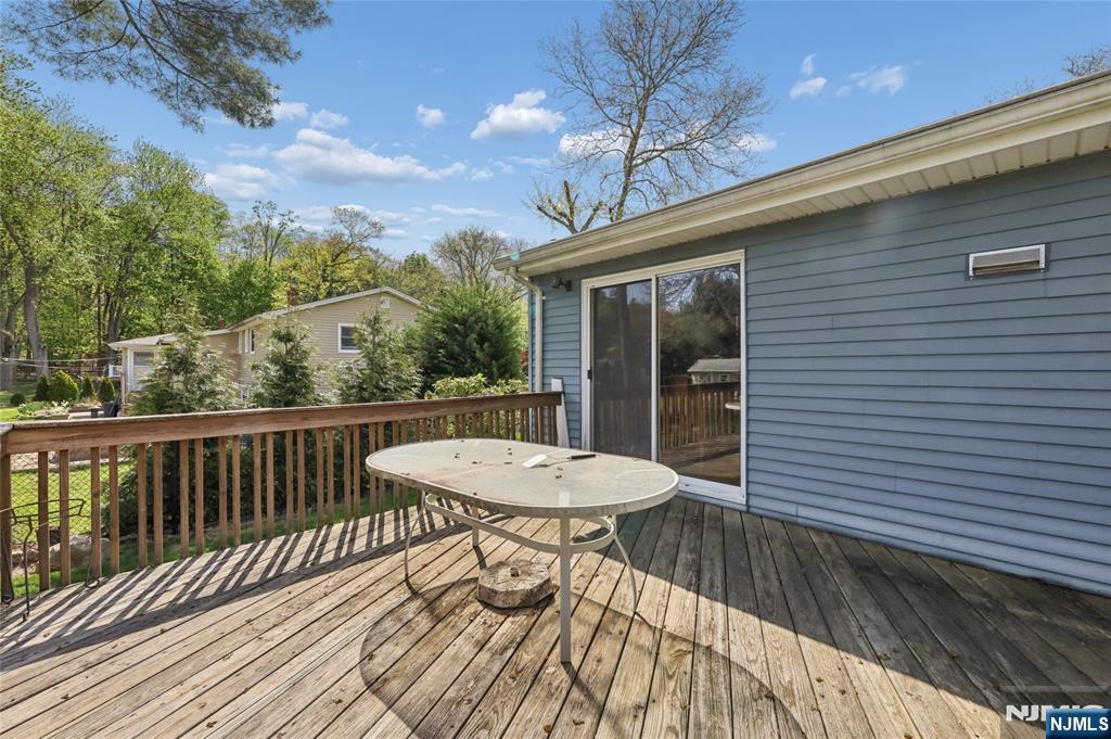 35 Robin Road Wayne, NJ 07470 - Photo 34 of 37 a view of a balcony with a table and chairs