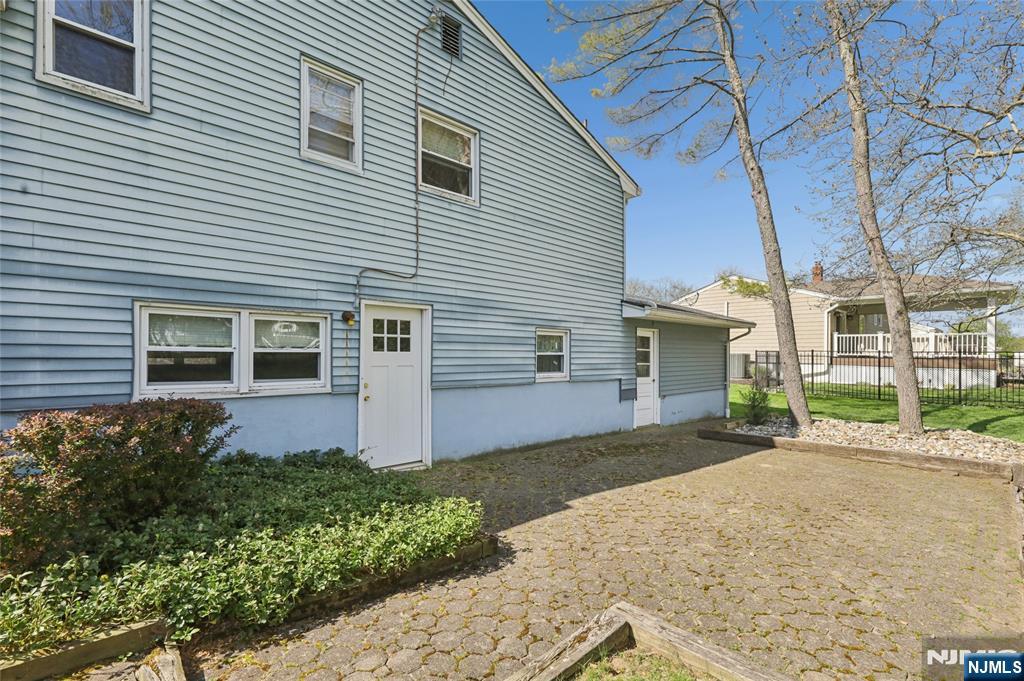 35 Robin Road Wayne, NJ 07470 - Photo 37 of 37 a front view of a house with a yard and garage