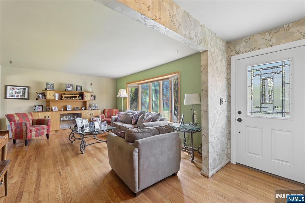 35 Robin Road Wayne, NJ 07470 - Photo 6 of 37 a living room with furniture and a wooden floor