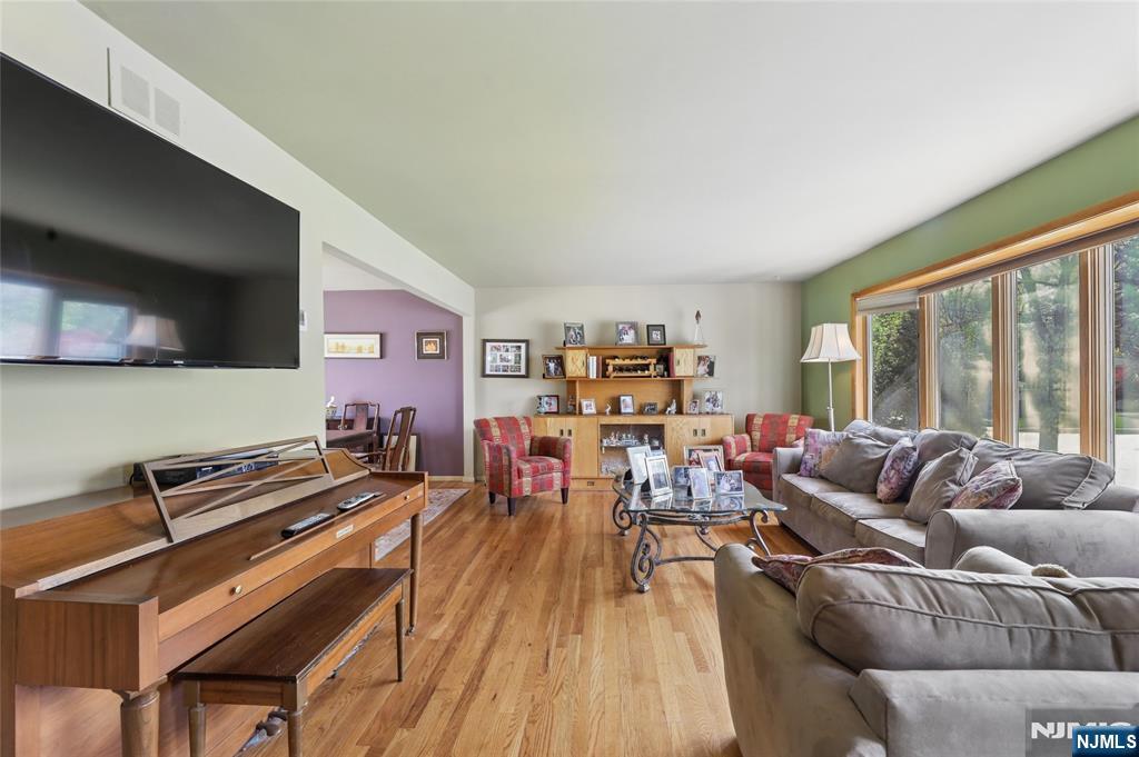 35 Robin Road Wayne, NJ 07470 - Photo 7 of 37 a living room with furniture and a flat screen tv