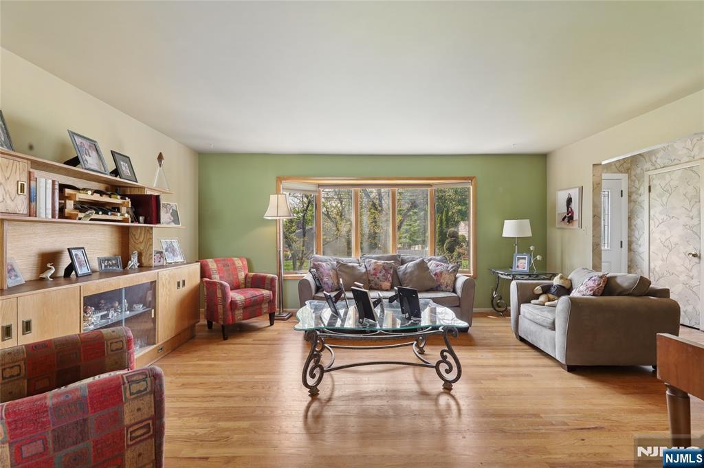 35 Robin Road Wayne, NJ 07470 - Photo 8 of 37 a living room with furniture and a large window