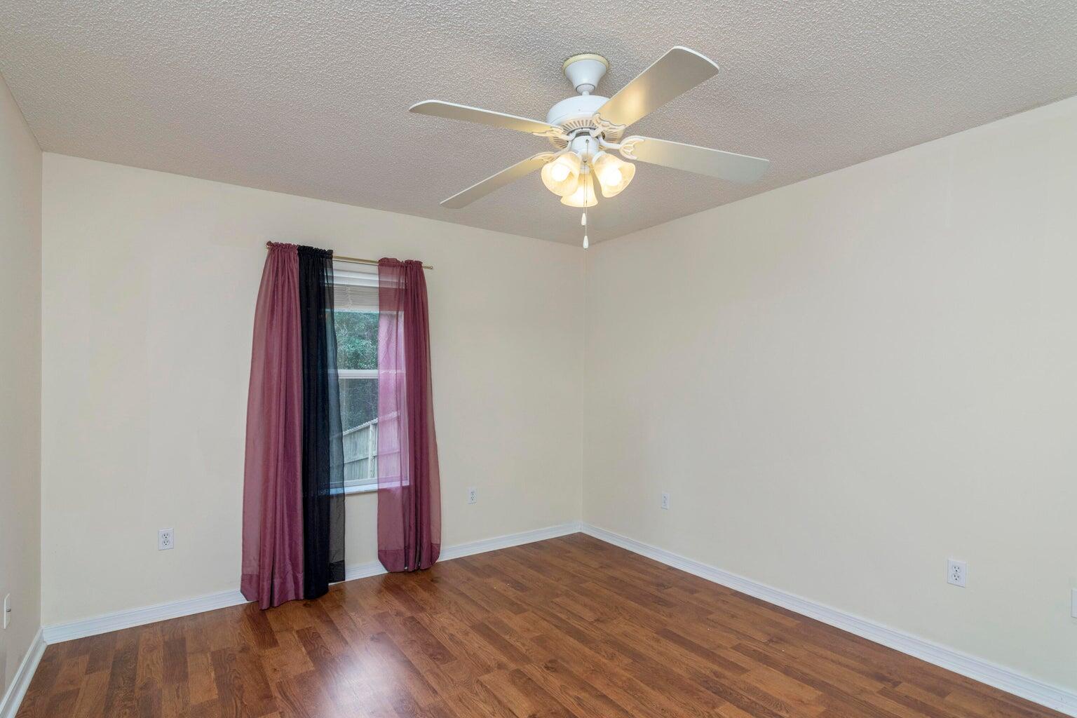 168 Cabana Way Crestview, FL 32536 - Photo 15 of 29 wooden floor in an empty room