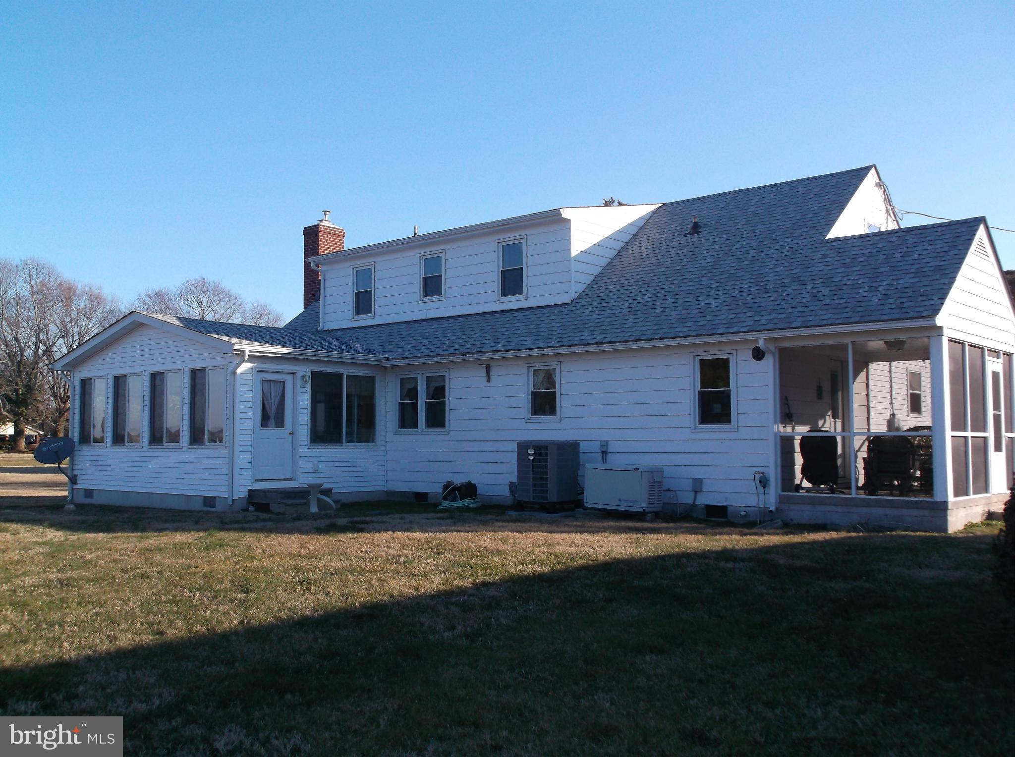 16237 Millers Wharf Road Ridge, MD 20680 - Photo 29 of 29 a front view of a house with a yard