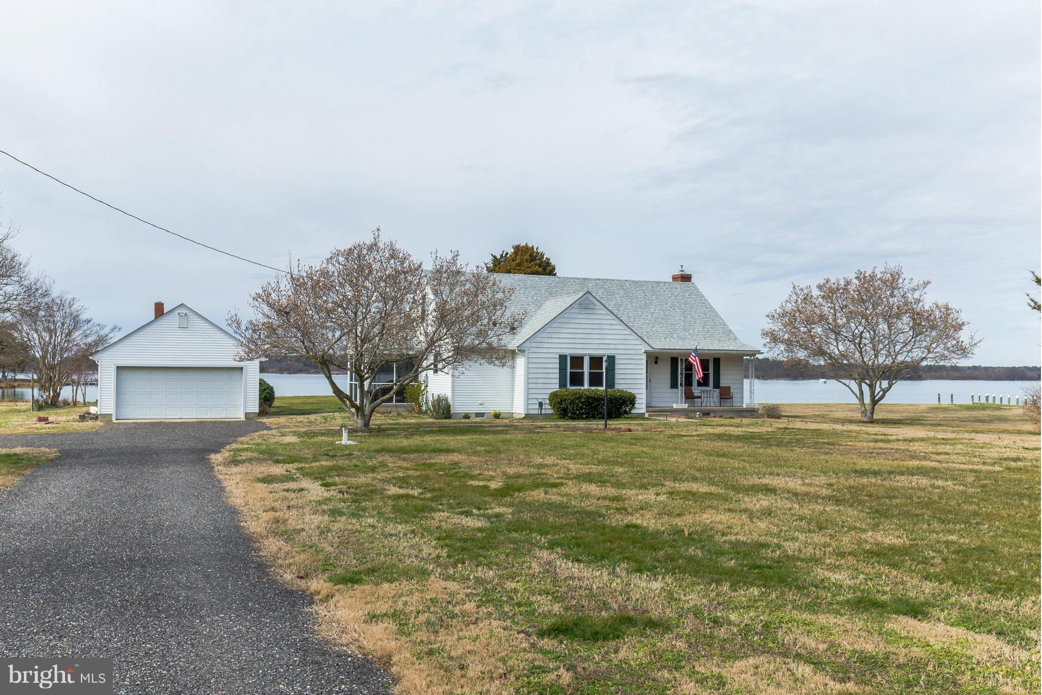 16237 Millers Wharf Road Ridge, MD 20680 - Photo 4 of 29 a front view of a house with a yard