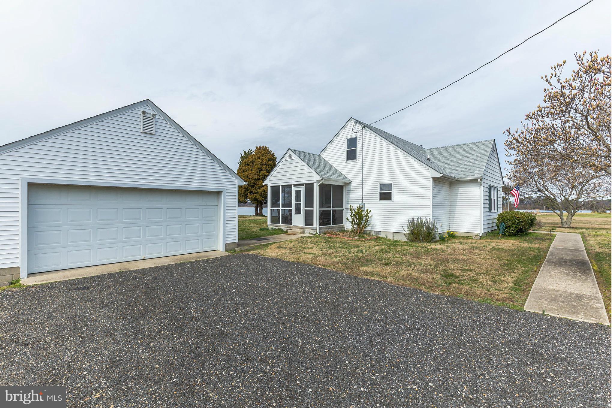 16237 Millers Wharf Road Ridge, MD 20680 - Photo 5 of 29 a view of a house with a yard and garage