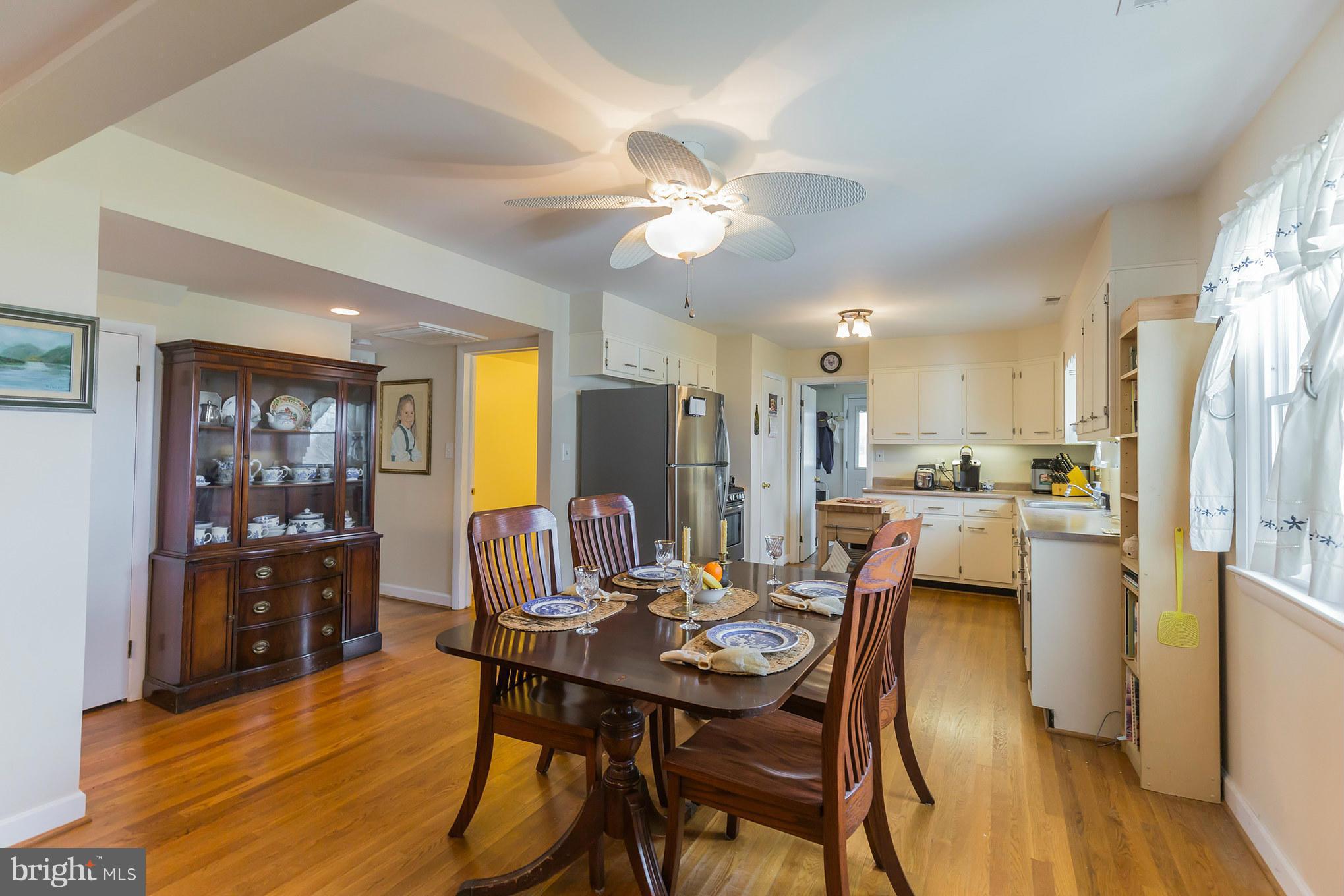 16237 Millers Wharf Road Ridge, MD 20680 - Photo 10 of 29 a view of a dining room with furniture and wooden floor