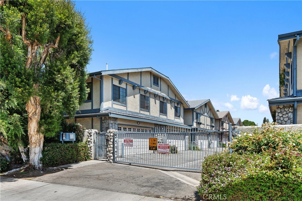 18435 Keswick, Unit 10 Reseda, CA 91335 - Photo 1 of 34 a front view of a house with a yard