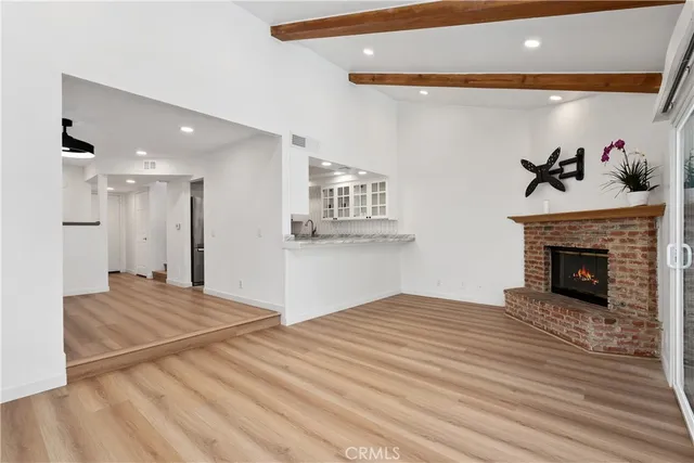 a bedroom with a bed and a fireplace