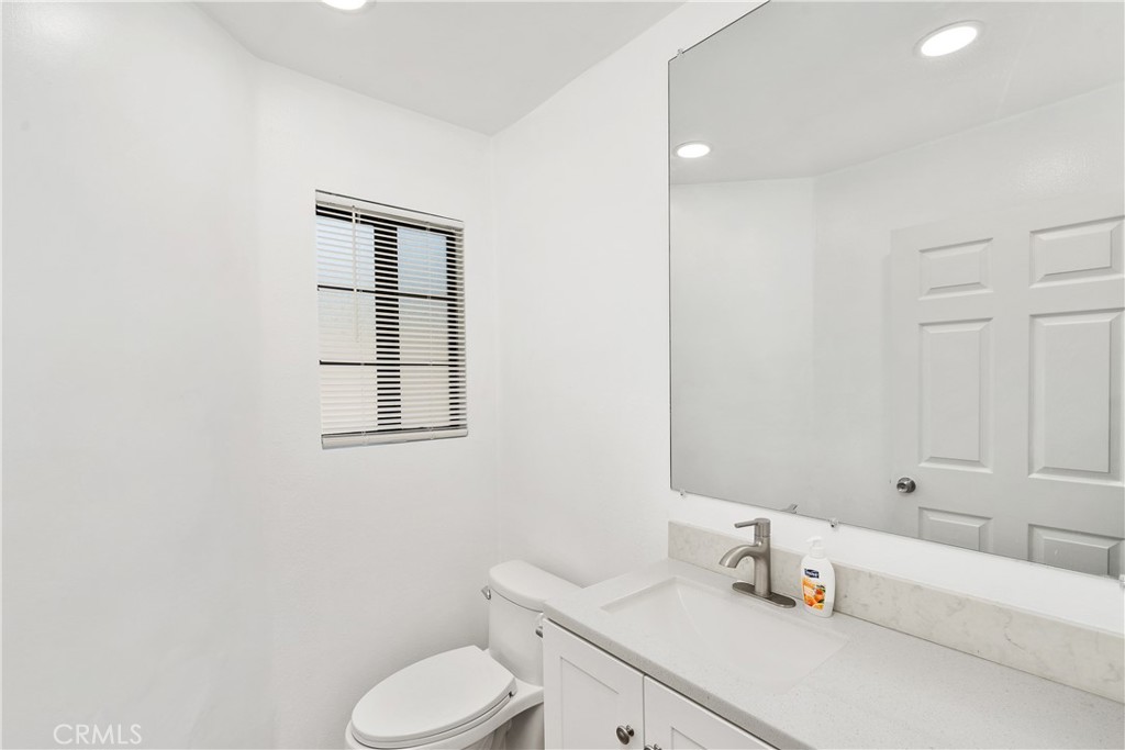 18435 Keswick, Unit 10 Reseda, CA 91335 - Photo 16 of 34 a bathroom with a sink toilet and vanity
