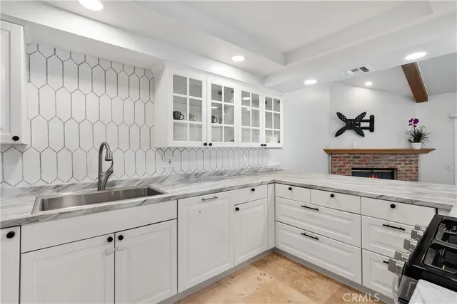 a kitchen with a sink and cabinets