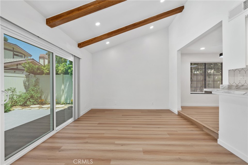 18435 Keswick, Unit 10 Reseda, CA 91335 - Photo 21 of 34 a view of an empty room with wooden floor and a window