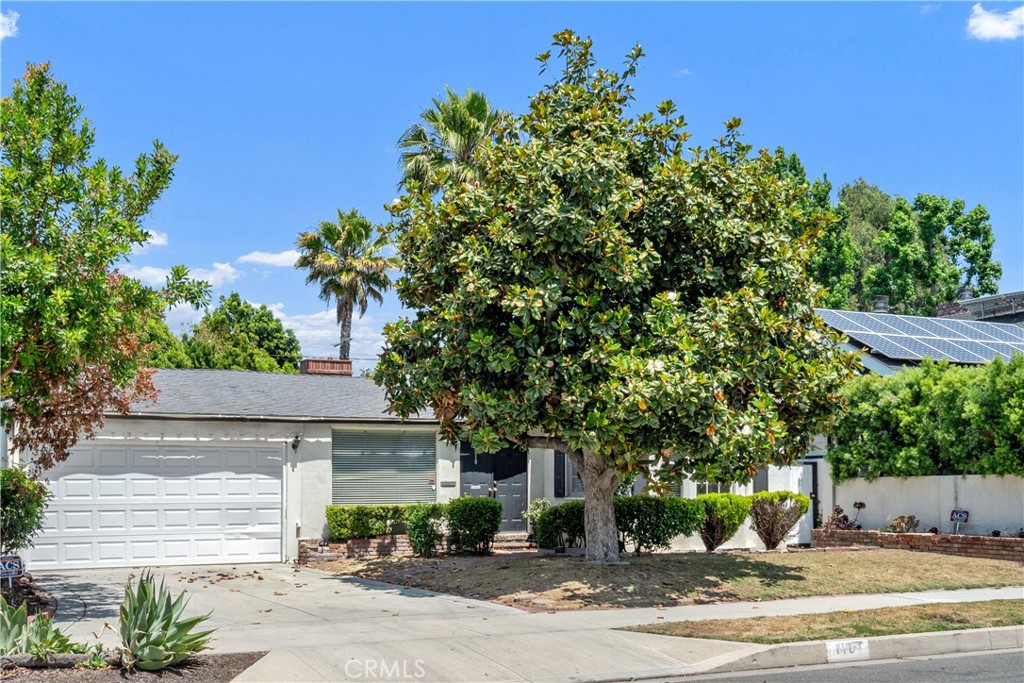 18435 Keswick, Unit 10 Reseda, CA 91335 - Photo 24 of 34 a front view of a house with a yard