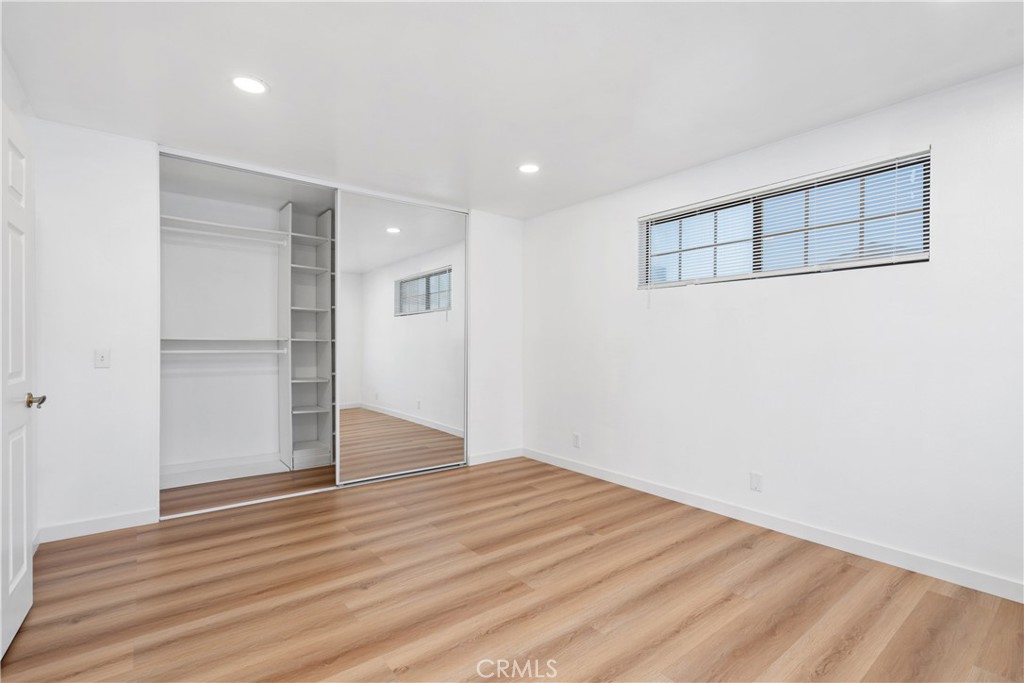 18435 Keswick, Unit 10 Reseda, CA 91335 - Photo 30 of 34 a view of an empty room with wooden floor