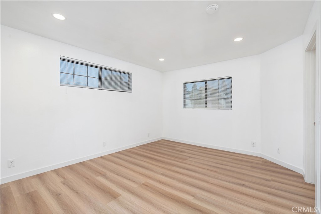 18435 Keswick, Unit 10 Reseda, CA 91335 - Photo 33 of 34 a view of a room with wooden floor and white walls