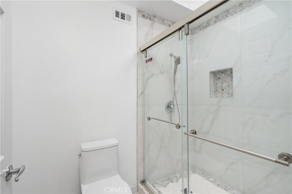 18435 Keswick, Unit 10 Reseda, CA 91335 - Photo 34 of 34 a bathroom with a shower and toilet