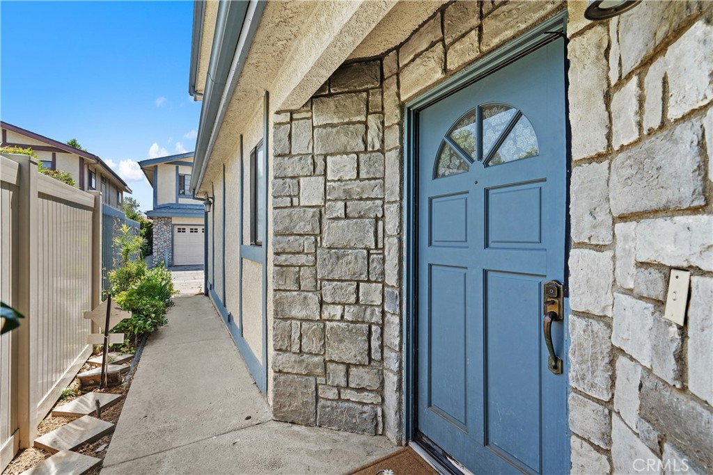 18435 Keswick, Unit 10 Reseda, CA 91335 - Photo 8 of 34 a couple of potted plants in front of door