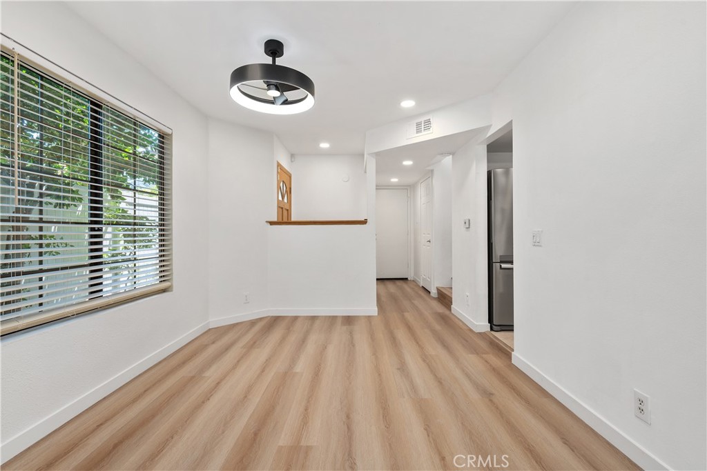 18435 Keswick, Unit 10 Reseda, CA 91335 - Photo 9 of 34 a view of empty room with wooden floor and fan