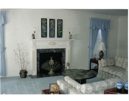 208 Florence Street Fall River, MA 02720 - Photo 4 of 8 a living room with furniture and a fireplace