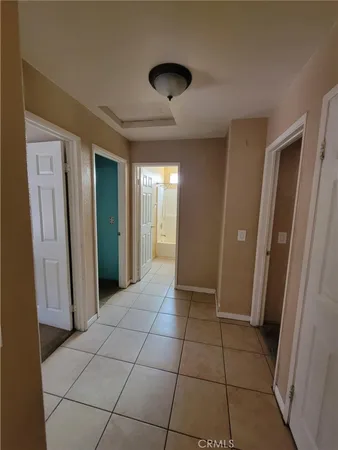 a view of a hallway and closet