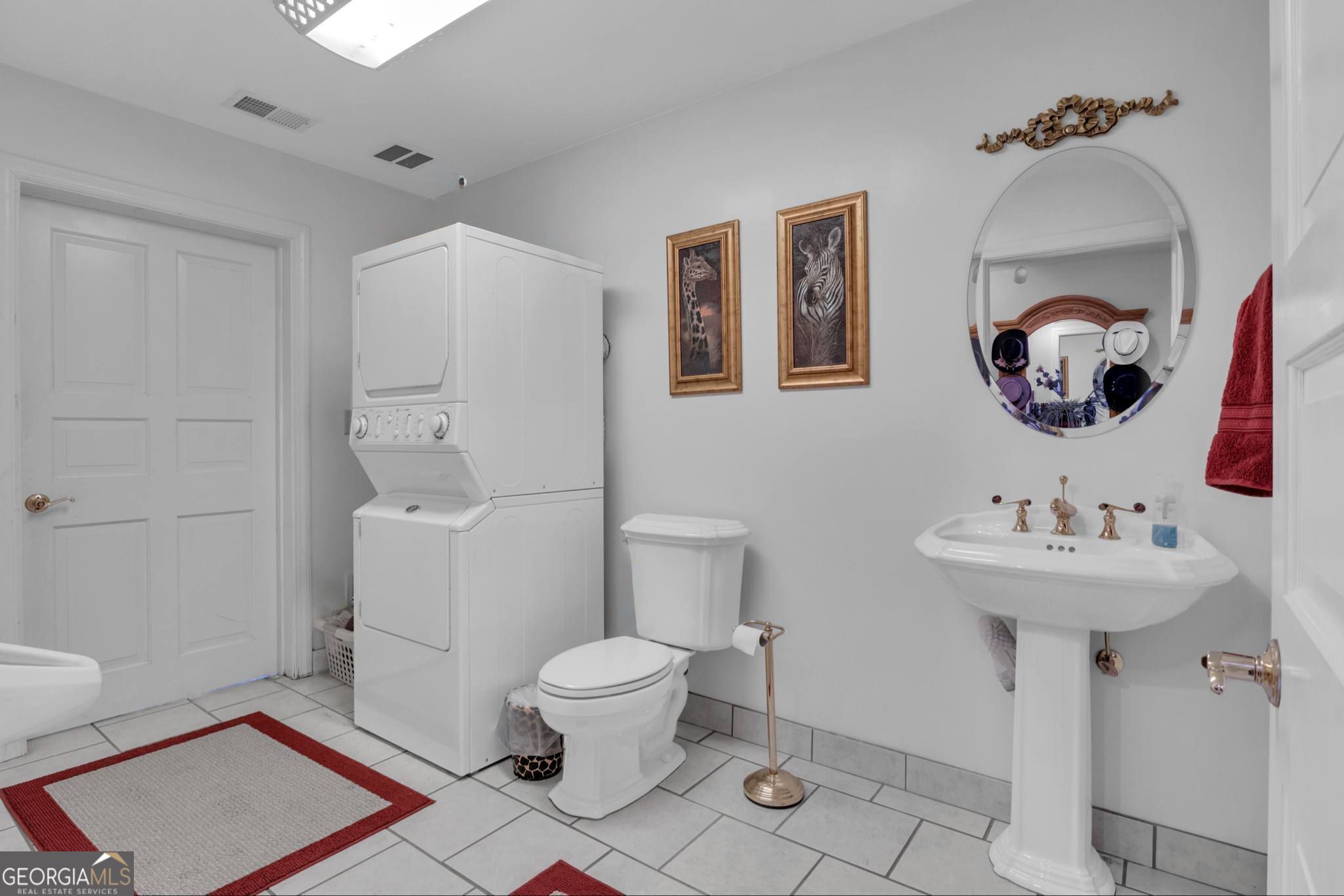 14501 Woolsey Road Hampton, GA 30228 - Photo 101 of 142 a bathroom with a sink mirror and toilet