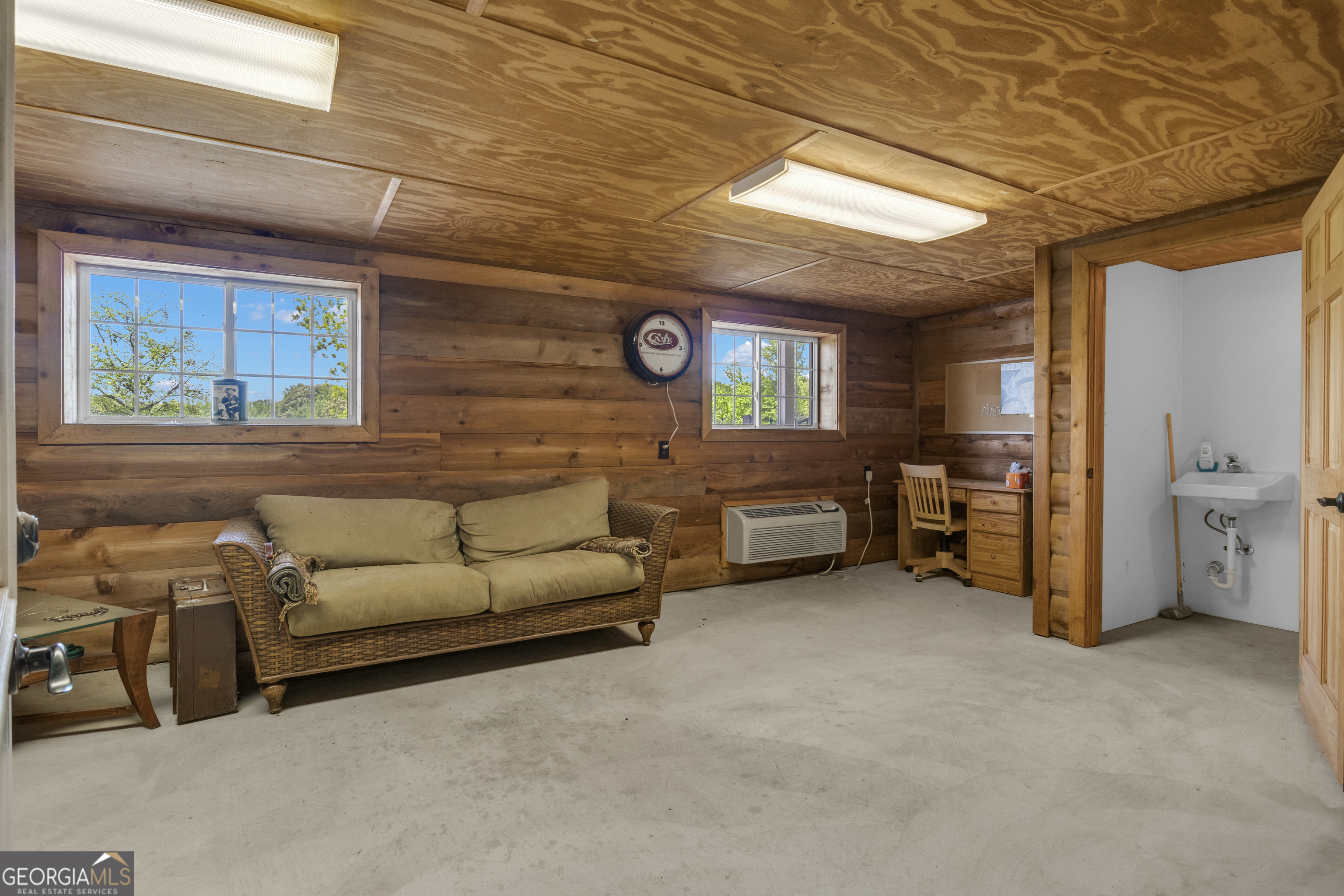14501 Woolsey Road Hampton, GA 30228 - Photo 123 of 142 a living room with furniture and a window