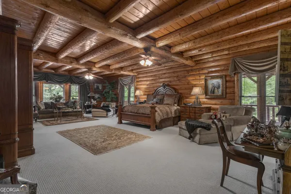 a living room with lots of furniture and a wooden floor