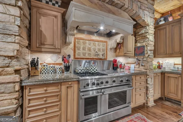 a kitchen with cabinets and stainless steel appliances