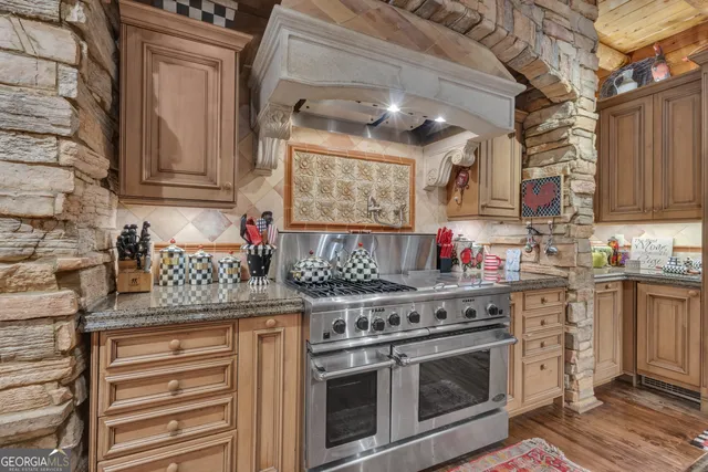 a kitchen with cabinets and stainless steel appliances
