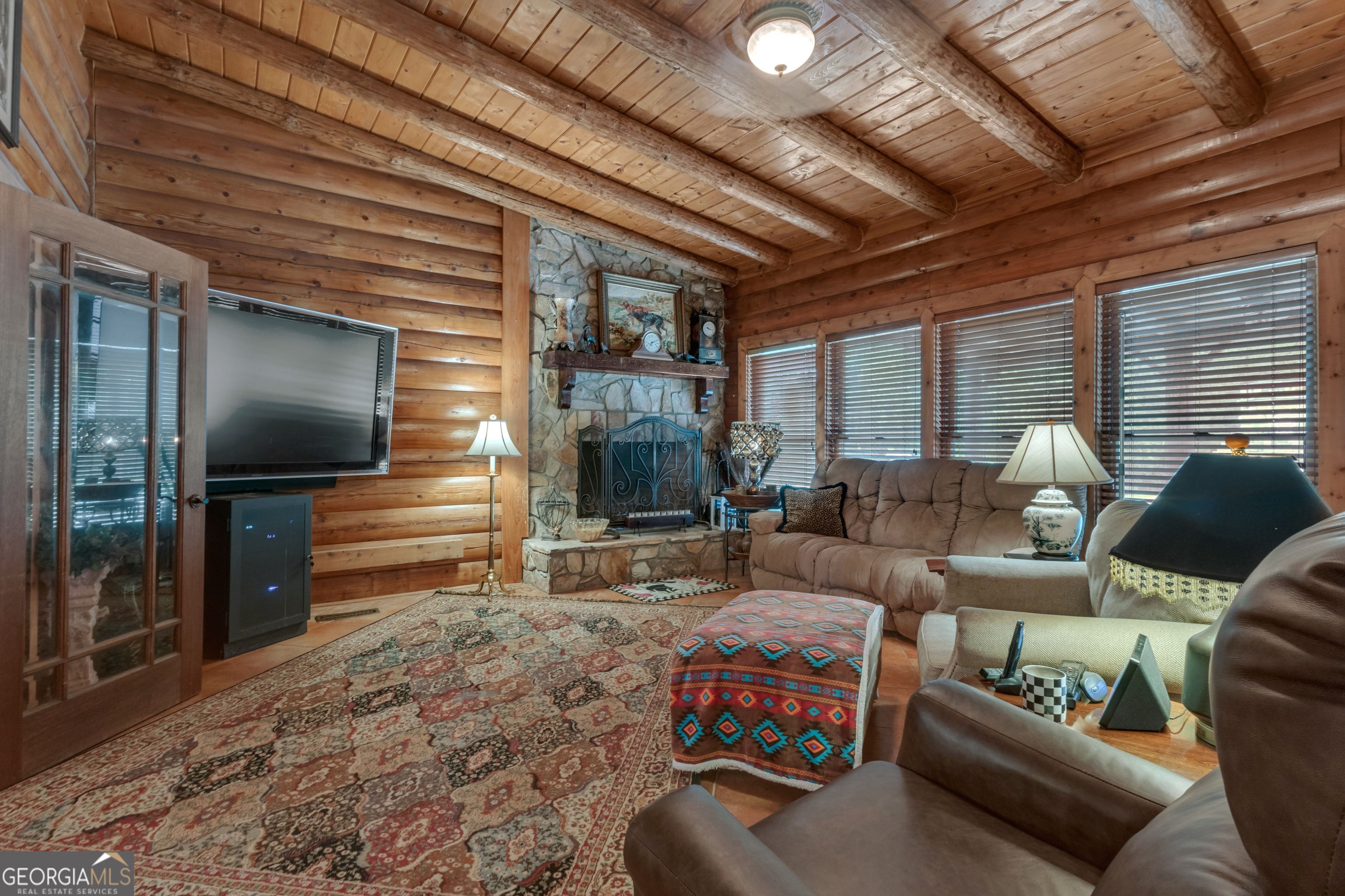 14501 Woolsey Road Hampton, GA 30228 - Photo 32 of 142 a living room with furniture and a flat screen tv