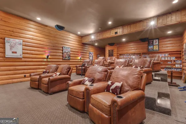 a bathroom with a sink mirror and toilet