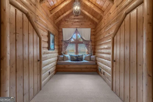 a view of a house with a yard and sitting area