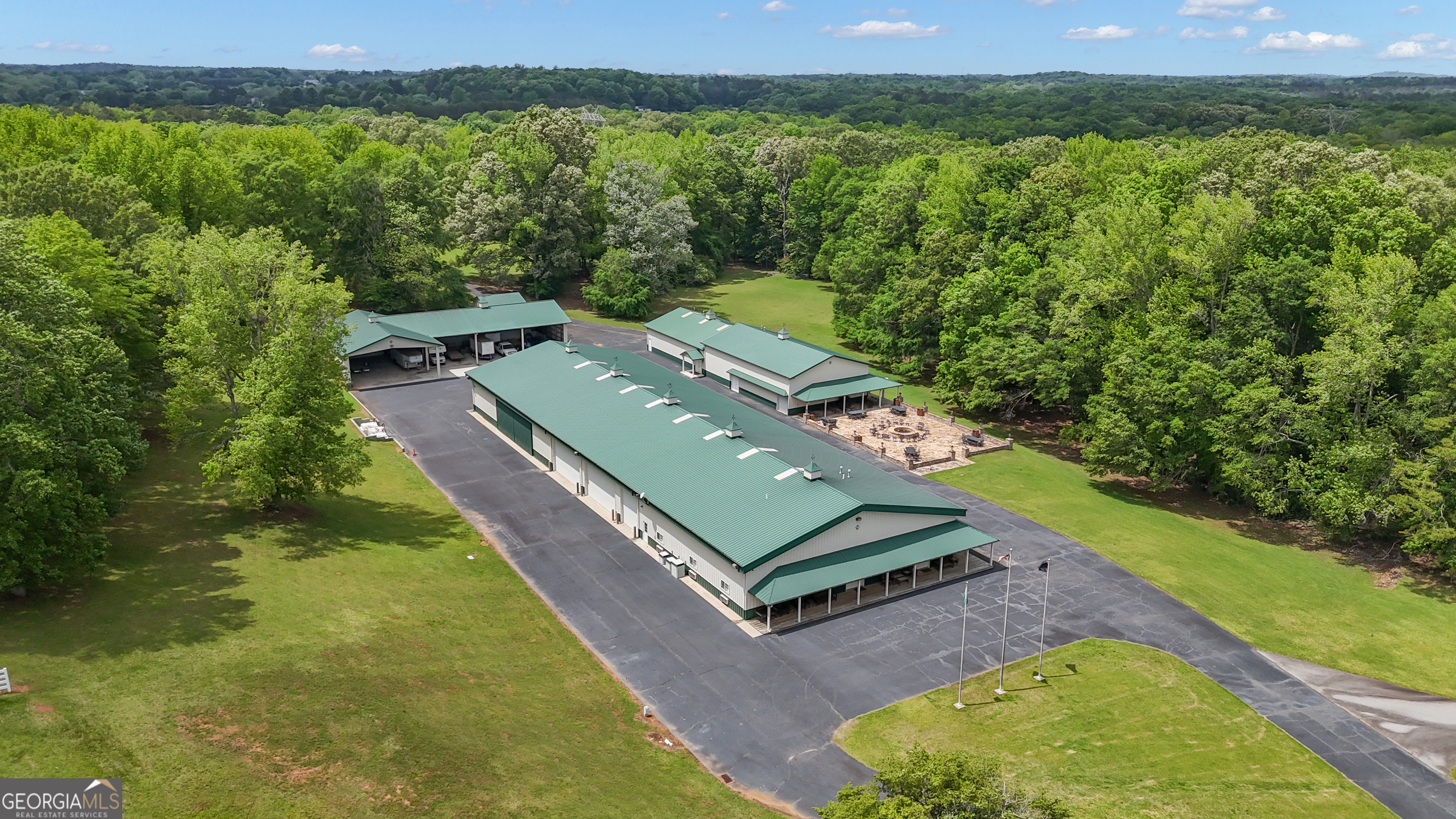 14501 Woolsey Road Hampton, GA 30228 - Photo 6 of 142 a view of a big yard with an outdoor seating and mountain view