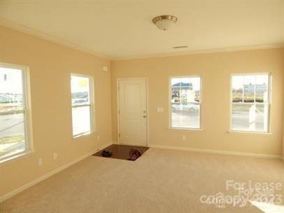 5204 Prosperity Church Road Charlotte, NC 28269 - Photo 7 of 8 a view of an empty room with a window