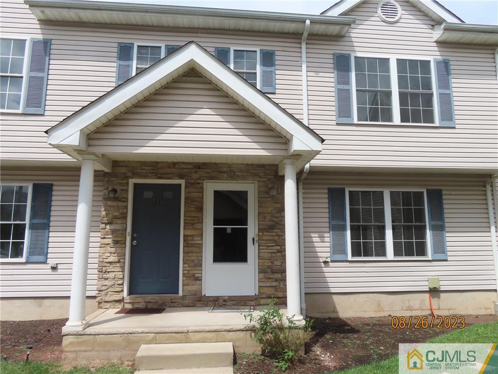a view of a house with brick walls
