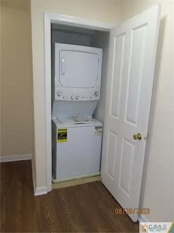 a kitchen with granite countertop a sink stove and cabinets