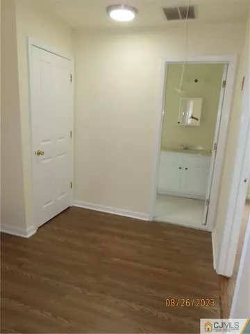 a kitchen with a stove sink and cabinets