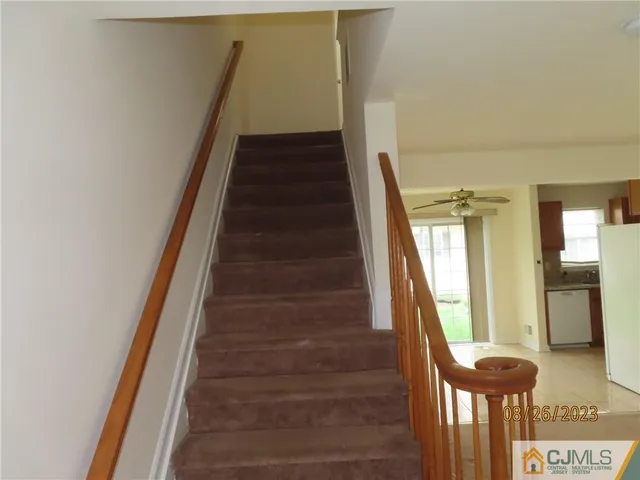 a kitchen with a stove and a refrigerator