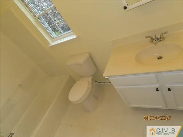 a bathroom with a bathtub and toilet