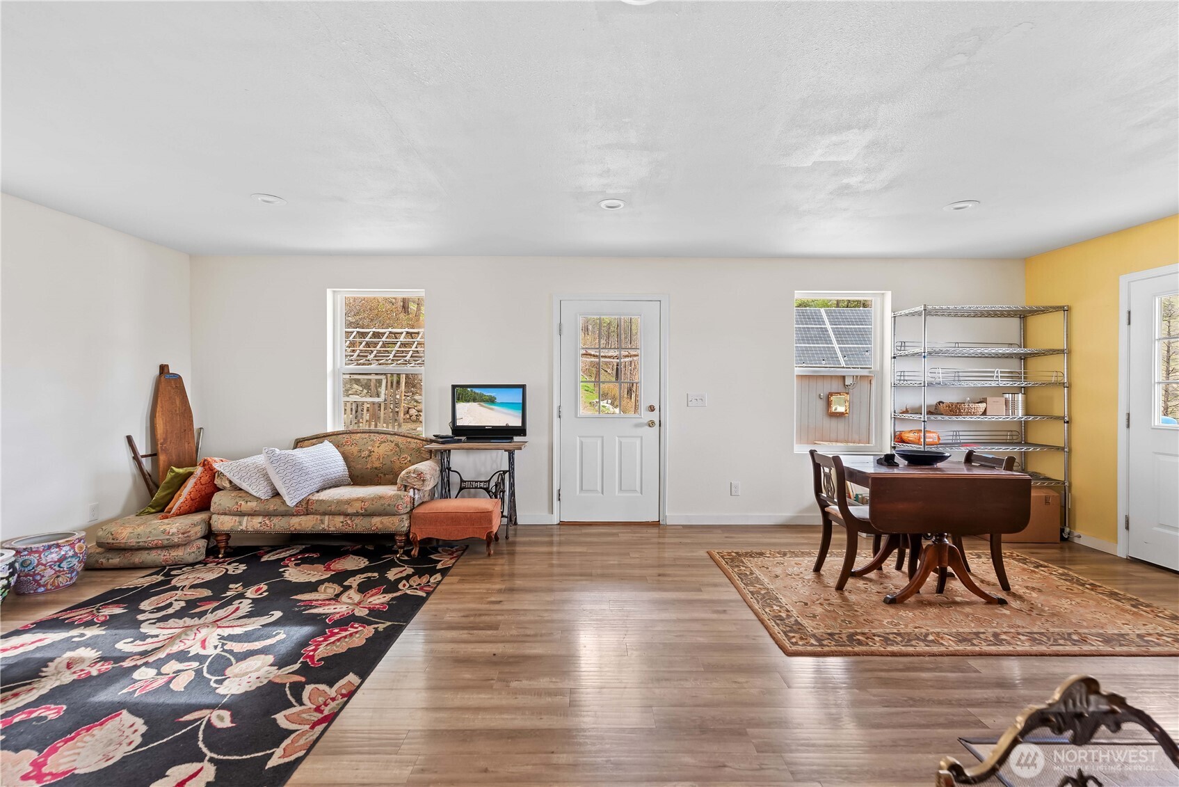 109 Granite Falls Road Chelan, WA 98816 - Photo 11 of 22 a living room with furniture a table and a piano
