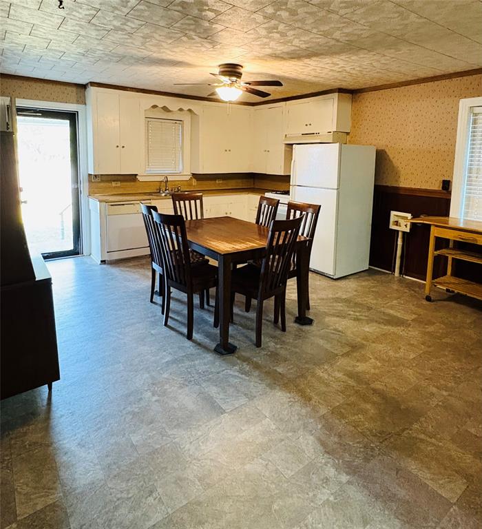 407 North Lane Street Decatur, TX 76234 - Photo 12 of 19 a view of a dining room with furniture and a table