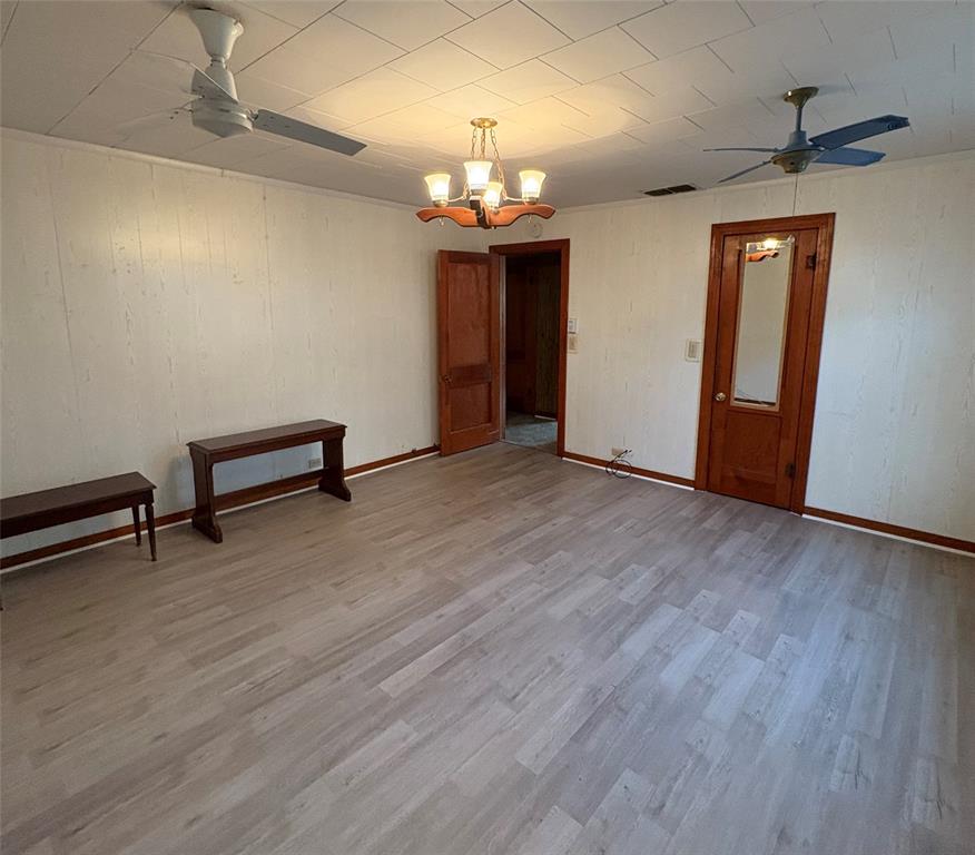 407 North Lane Street Decatur, TX 76234 - Photo 7 of 19 a view of a room with wooden floor chandelier and windows