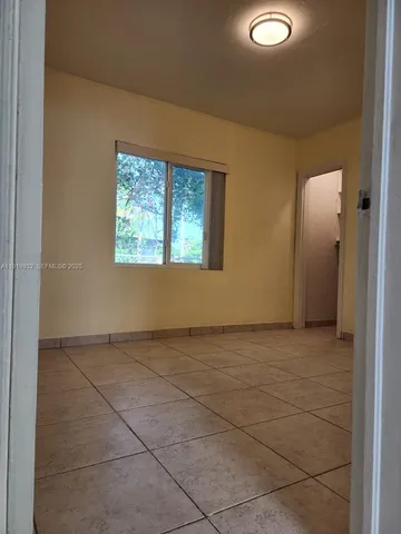 a view of an empty room and window